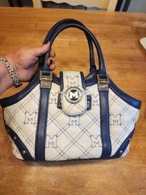 Metrocity leather handbag in white and navy with a quilted monogram pattern